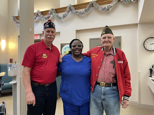 A joyful moment shared between veterans and a staff member.