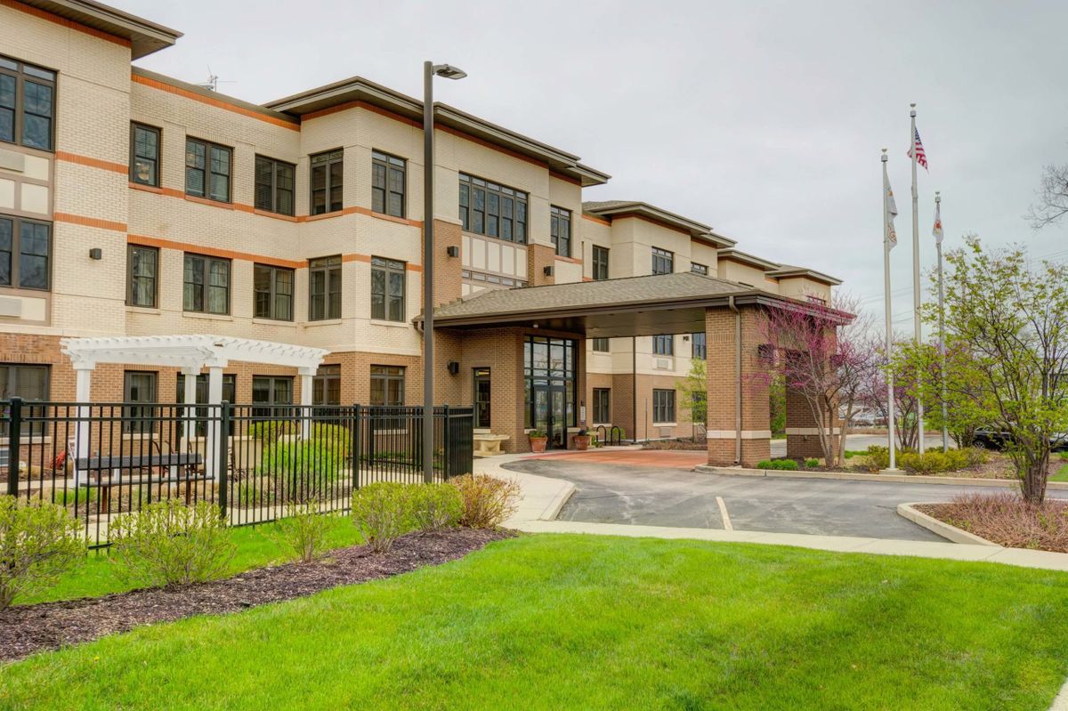 A modern office building with a landscaped entrance.