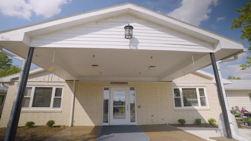 Entrance of a well-lit building with a welcoming design.