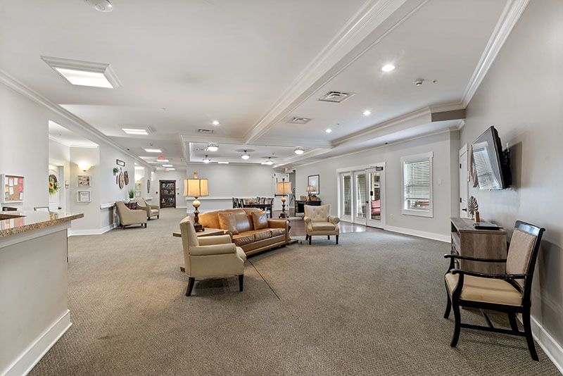 A spacious and well-decorated living room with comfortable seating and elegant decor.