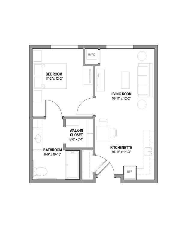 A floor plan of a one-bedroom apartment featuring a living room, kitchenette, bathroom, and walk-in closet.