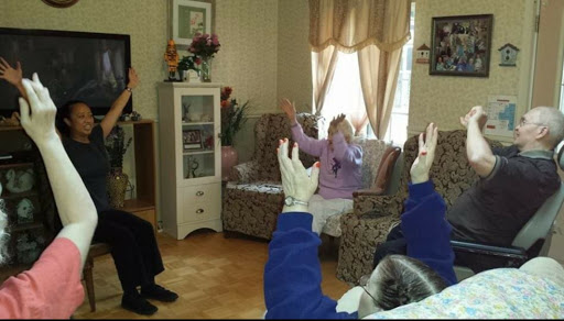 Residents engaged in a group activity at a care home.