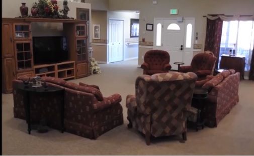A cozy living room with comfortable seating and a television.