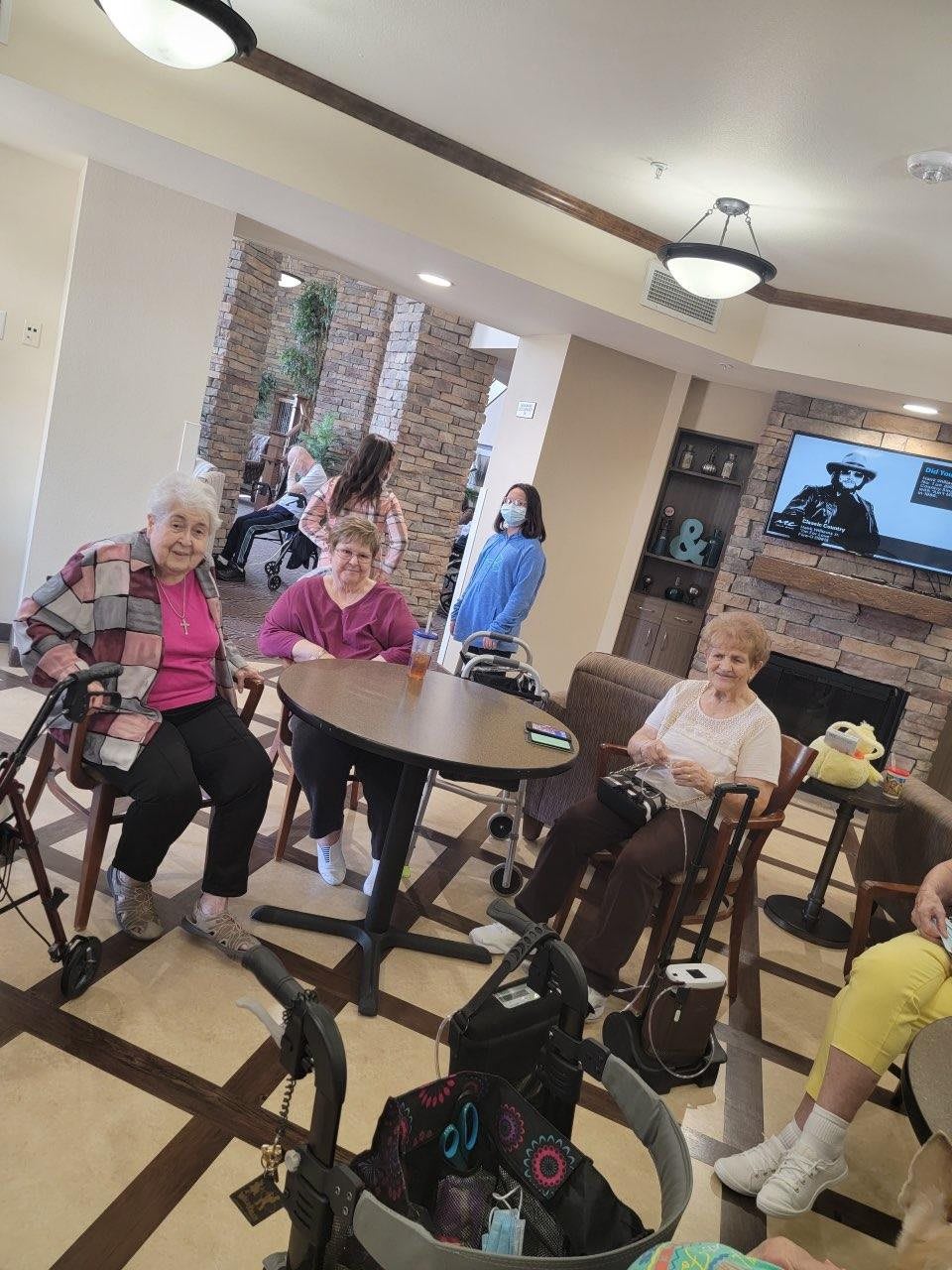 A group of seniors socializing in a communal area.