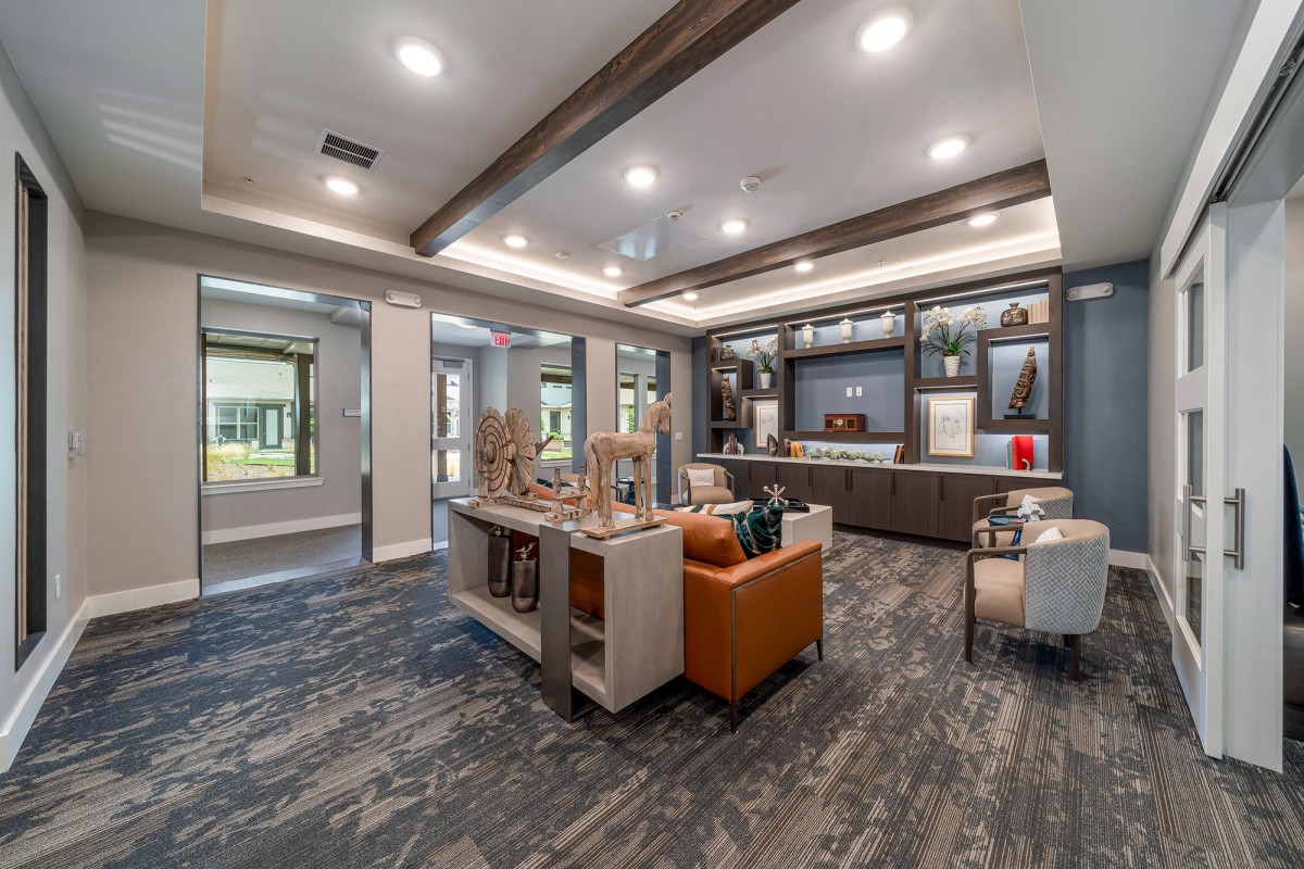 A modern and cozy lobby area with stylish furniture and lighting.