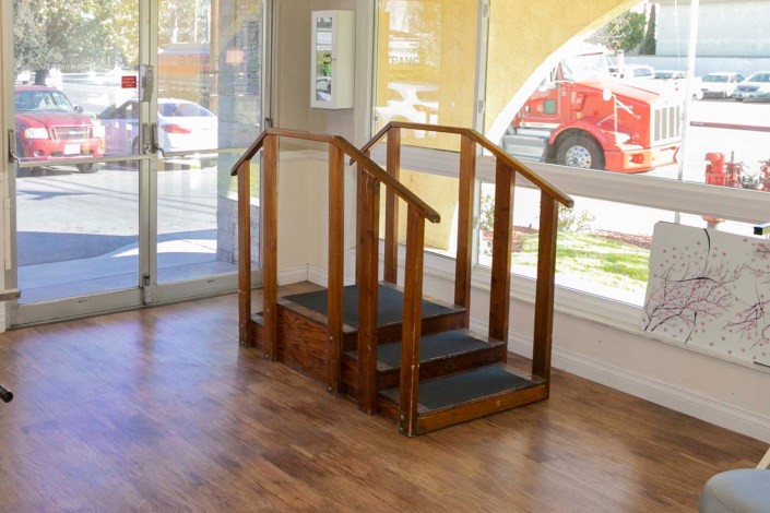 A set of indoor therapy stairs used for rehabilitation exercises.