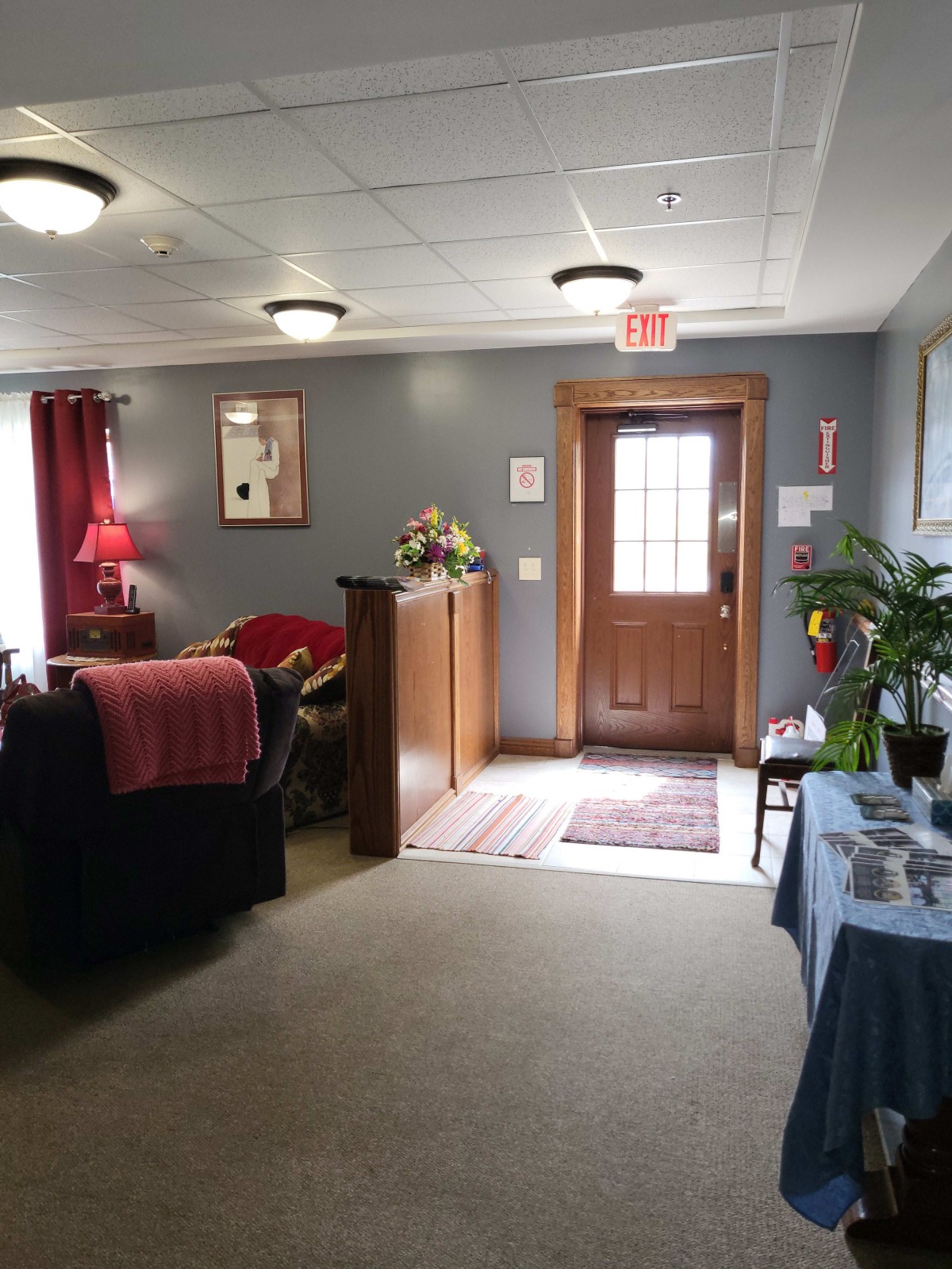 A cozy interior space with comfortable seating and decorative elements.
