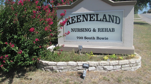 Sign of Keeneland Nursing & Rehab surrounded by colorful landscaping.