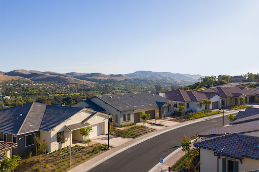A serene suburban neighborhood featuring modern homes with mountain views.