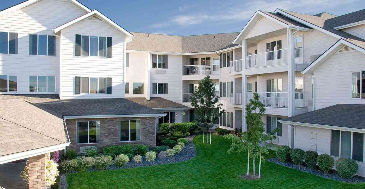 A well-maintained residential apartment complex with neatly landscaped grounds.