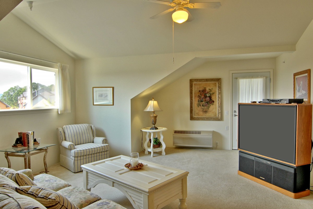 A cozy living room with comfortable seating and elegant decor.