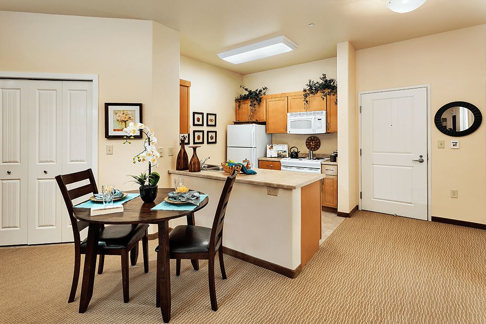 A cozy modern apartment kitchen and dining area with stylish decor.