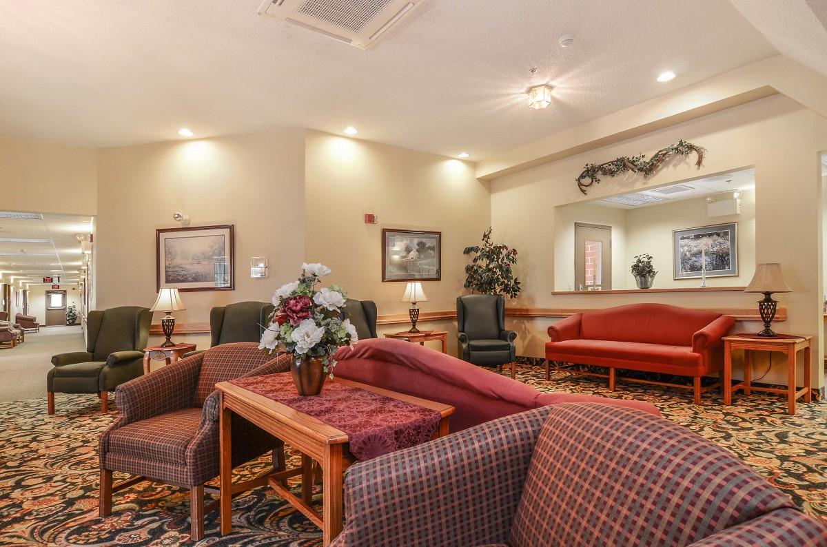 A cozy hotel lobby with comfortable seating and warm lighting.