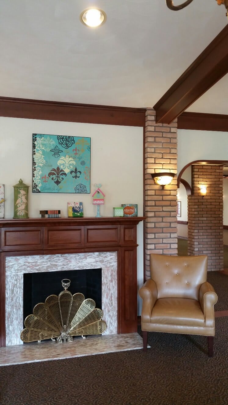 A cozy living room with a fireplace and stylish decor.