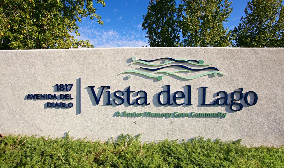 Sign for Vista del Lago, an assisted memory care community.