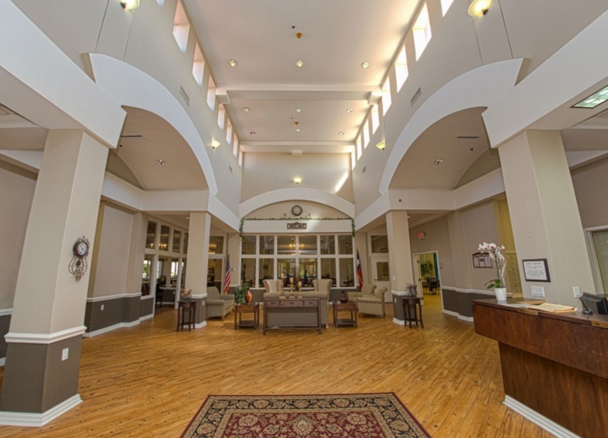 A spacious lobby with arched ceilings and stylish furniture.