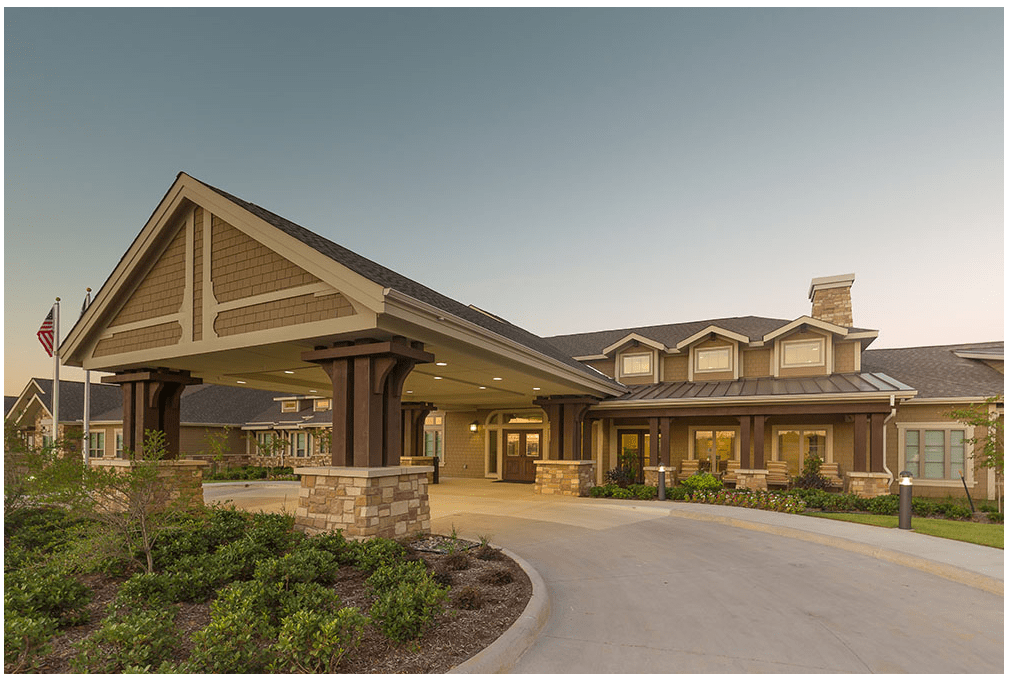 A residential building with a welcoming entrance and well-maintained landscaping.