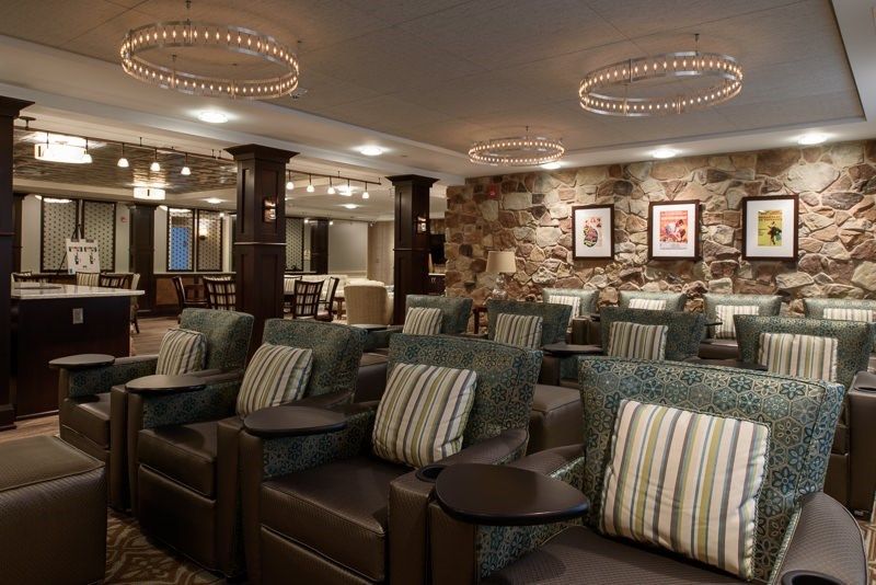 A luxurious lounge area with comfortable seating and modern lighting.
