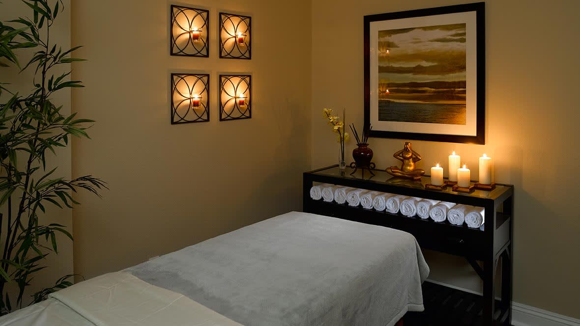 A tranquil spa room with soft lighting and soothing decor, perfect for relaxation.