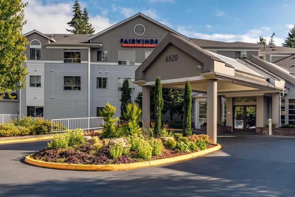 The exterior view of the Fairwinds hotel entrance with well-maintained landscaping.