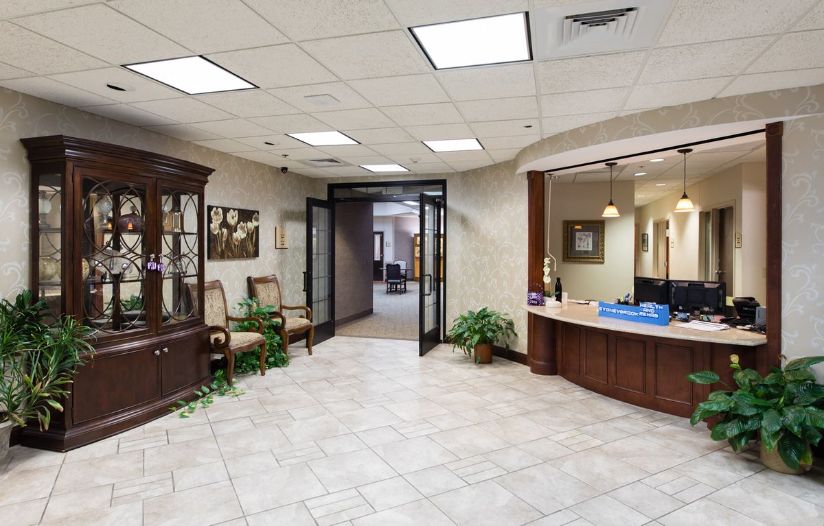 A welcoming reception area with comfortable seating and a front desk.