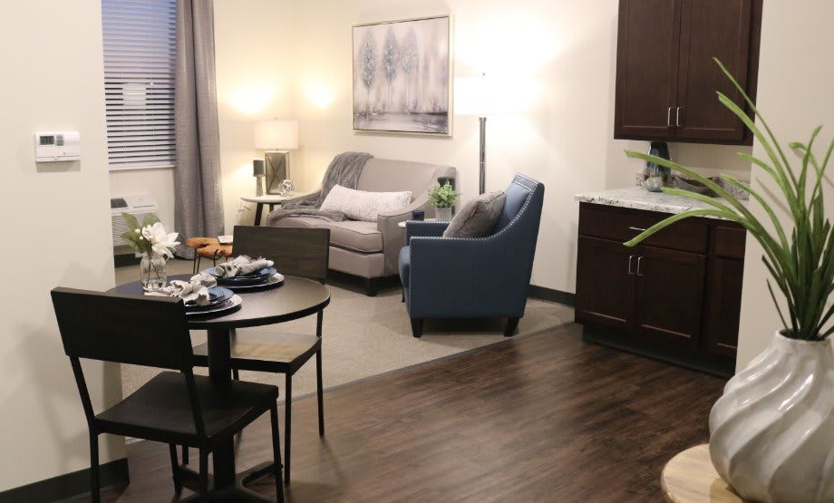 A cozy living room with modern furniture and elegant decor.