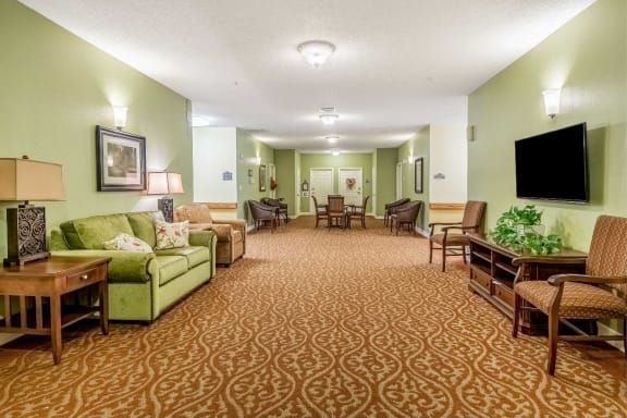 A spacious lobby area with comfortable seating and warm lighting.