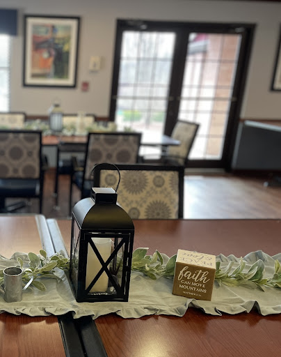 A cozy dining area adorned with decorative elements, including a lantern and a touch of greenery.
