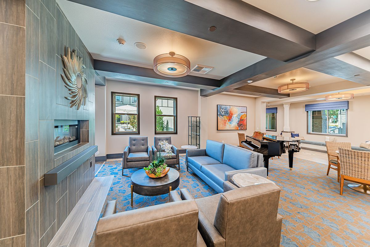 A modern living room with stylish furniture and decorative artwork.