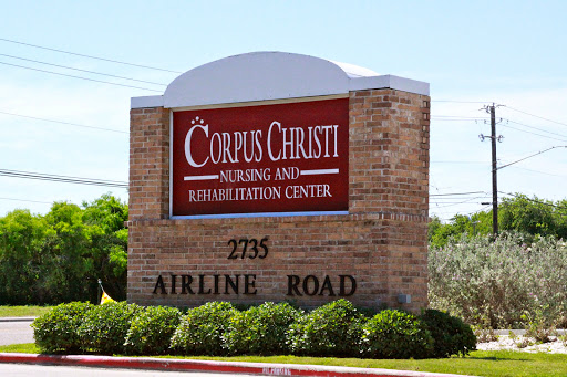Sign for Corpus Christi Nursing and Rehabilitation Center located on Airline Road.