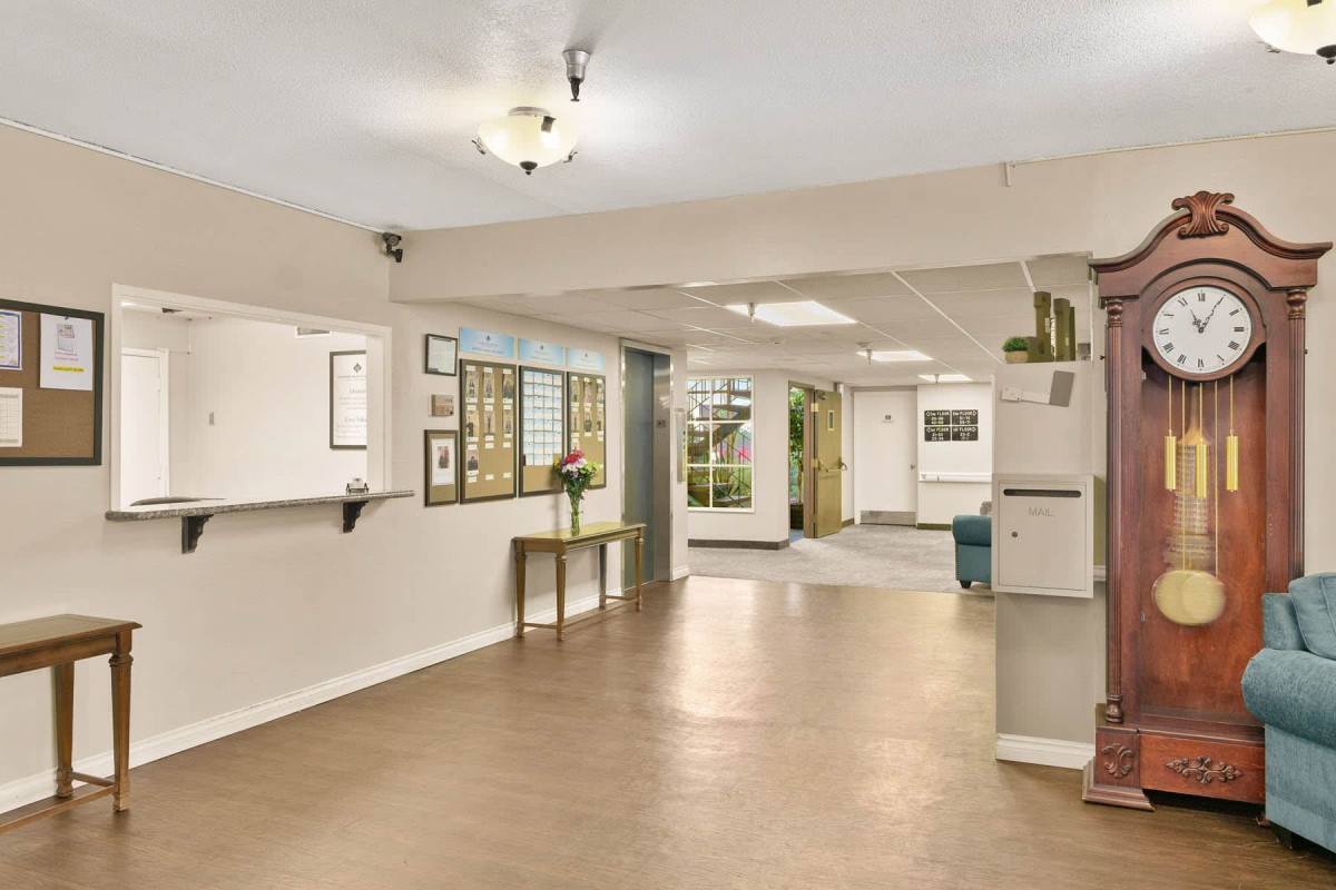 Spacious and welcoming lobby with a reception desk and seating area.