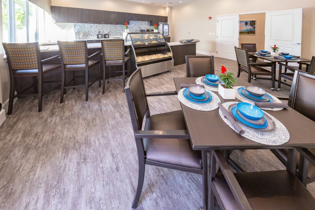 A modern dining area with elegantly set tables and comfortable seating.