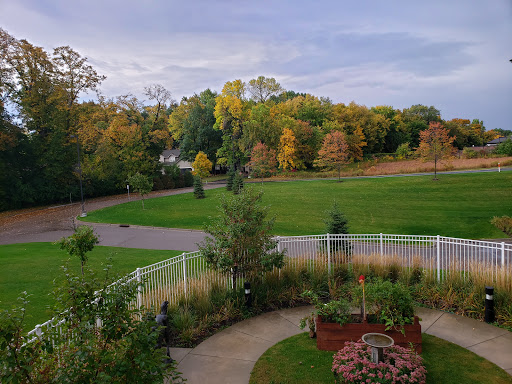A serene view of a park showcasing the vibrant colors of autumn.