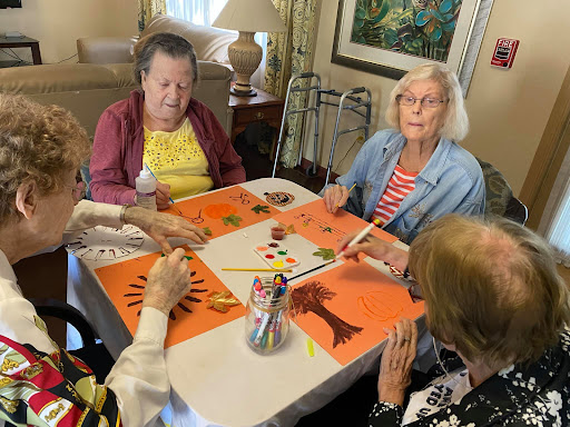 Seniors engage in a creative art activity, fostering community and connection.