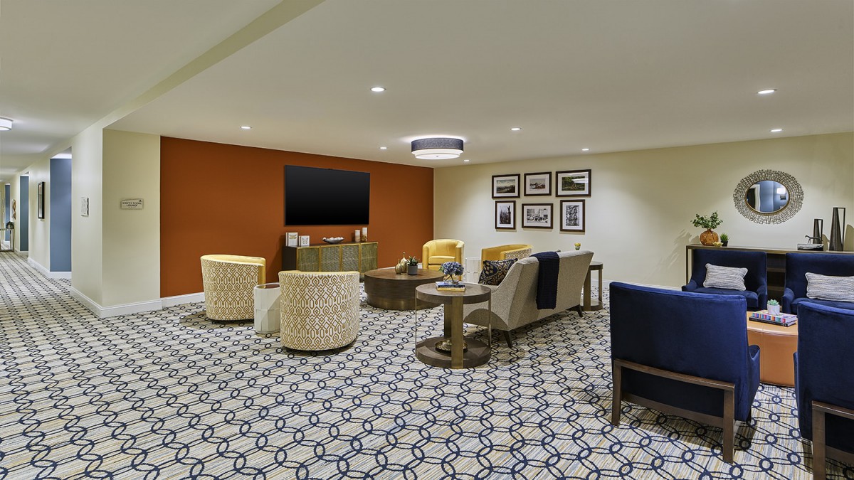 A modern living room with comfortable seating and a television display.