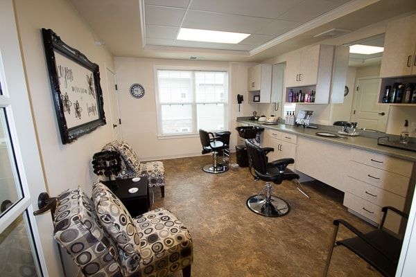 A cozy hair salon with styling stations and a waiting area.