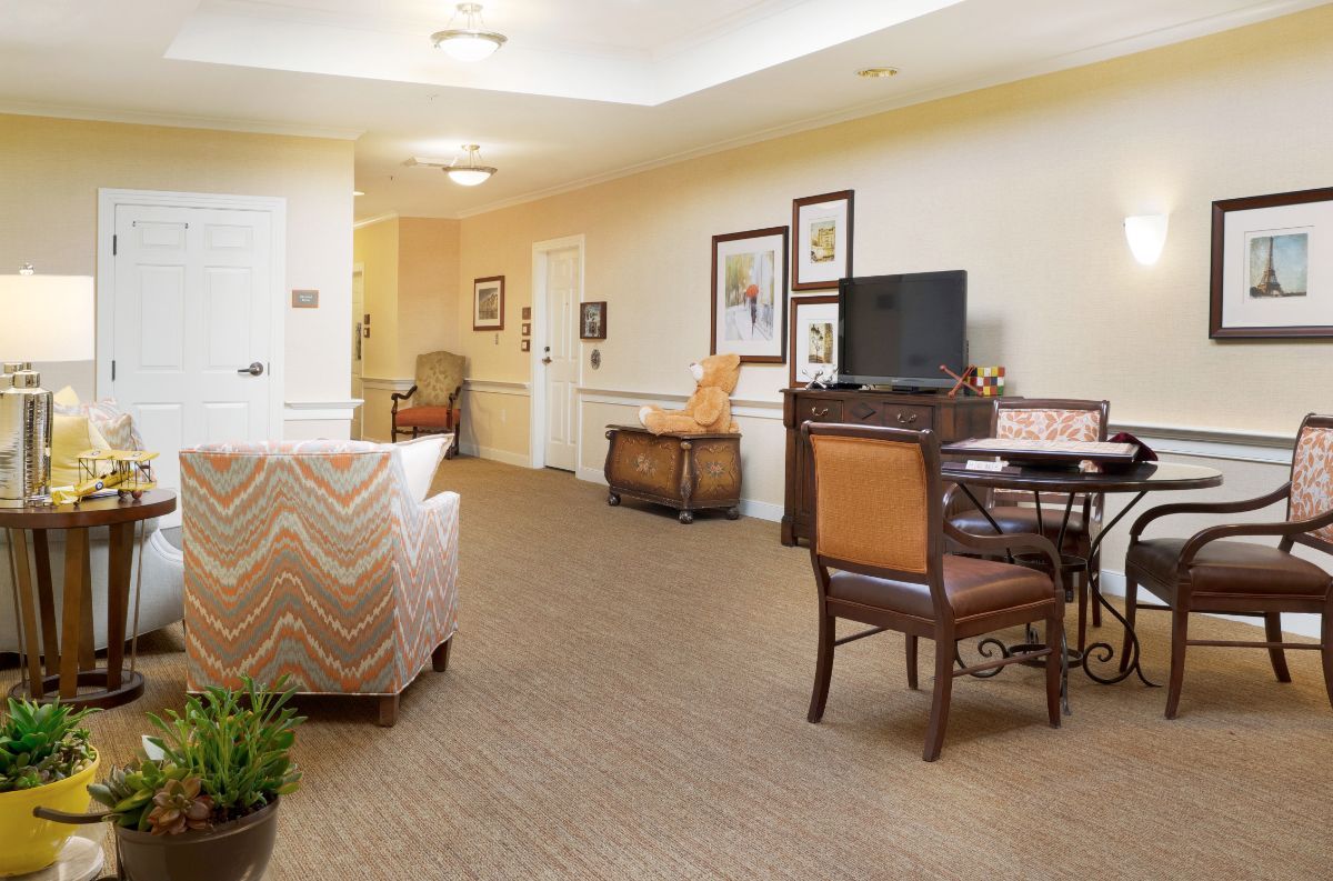 A cozy living room with comfortable seating and a television.