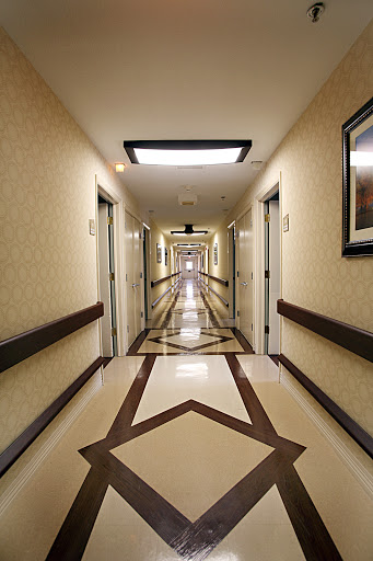 A well-lit hallway showcasing elegant design and flooring.