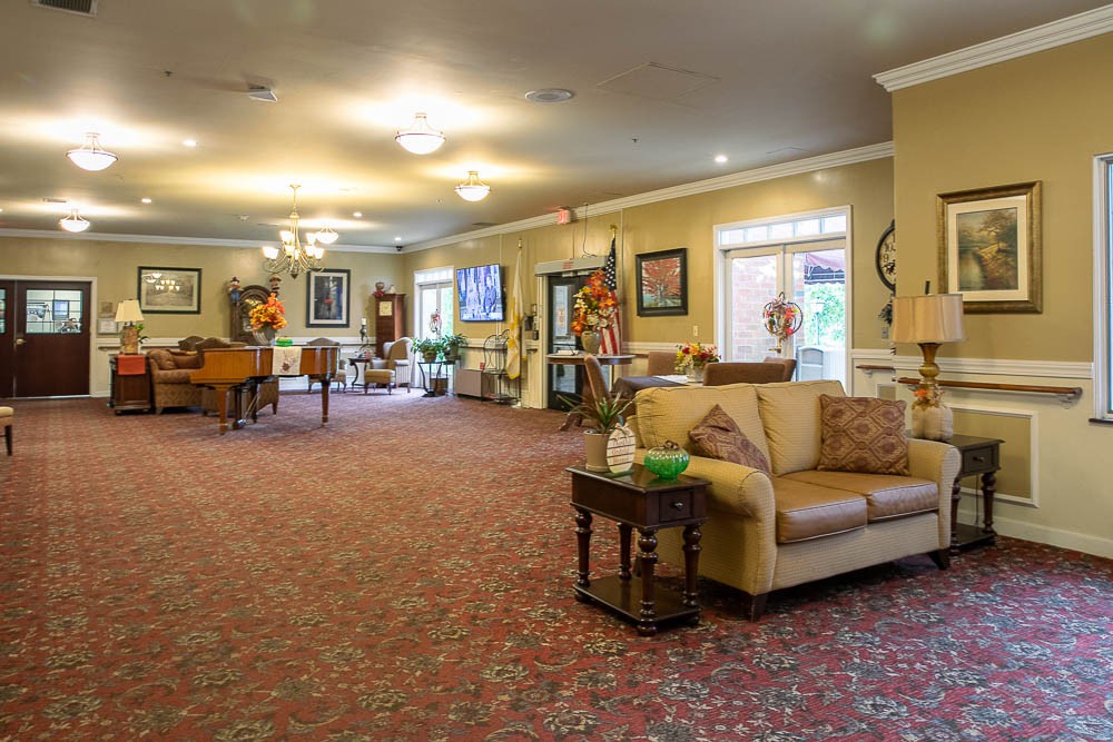 A spacious and elegantly decorated lobby area featuring comfortable seating and ambient lighting.