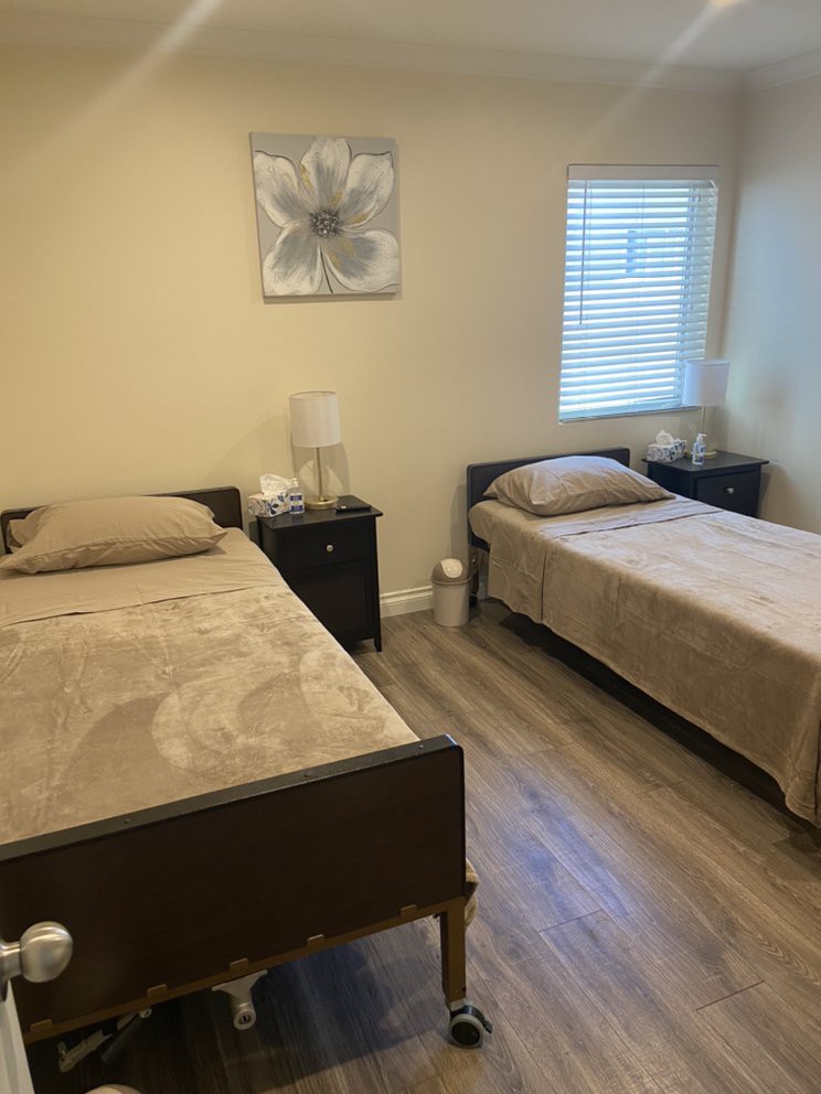 A cozy bedroom with two twin beds and a minimalist decor.