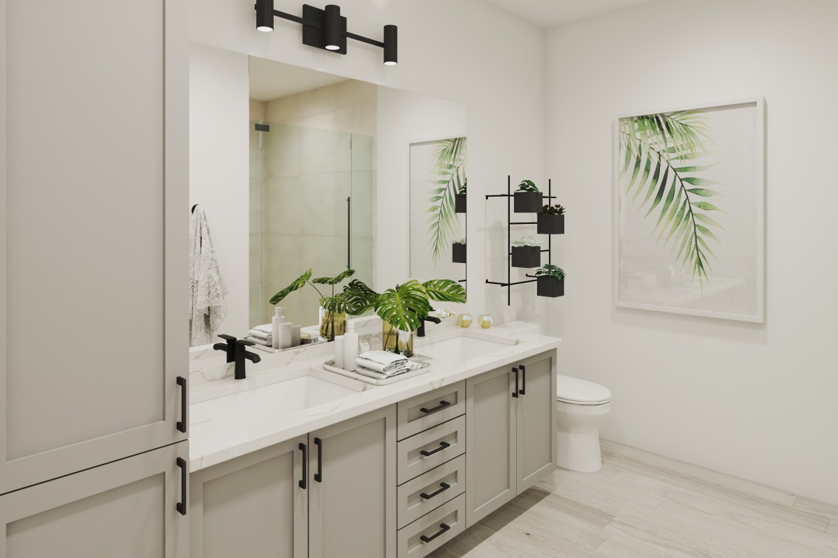A modern bathroom featuring a sleek vanity with dual sinks, decorative plants, and stylish lighting fixtures.