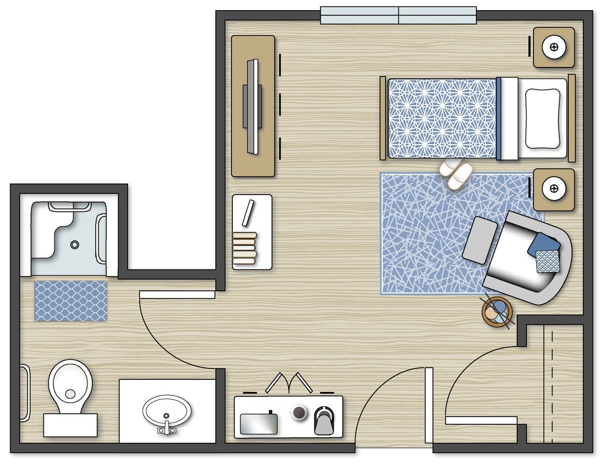 A floor plan of a small apartment featuring a bedroom, bathroom, and kitchenette.