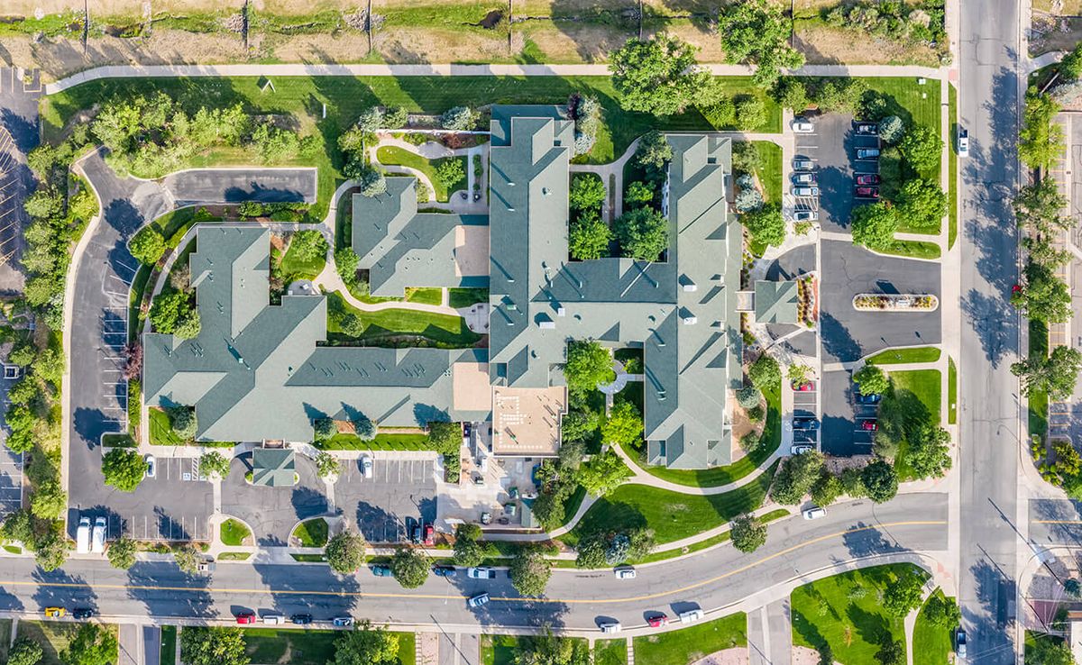 Aerial view of a complex with extensive greenery and landscaping.