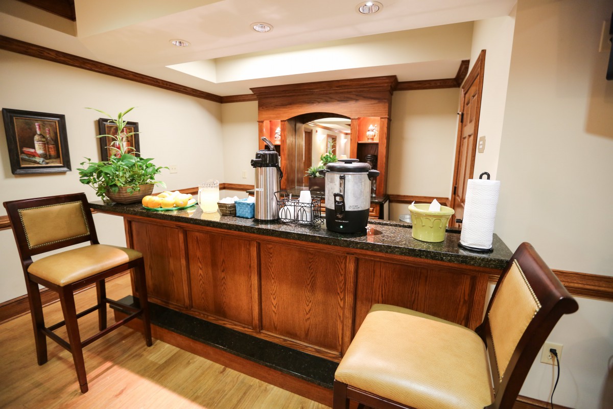 A cozy waiting area with a coffee station and comfortable seating.