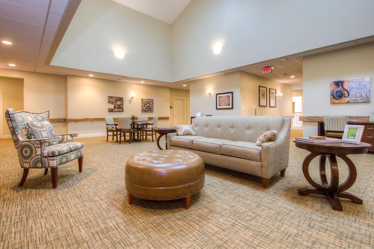 A cozy lounge area with comfortable seating and warm lighting.
