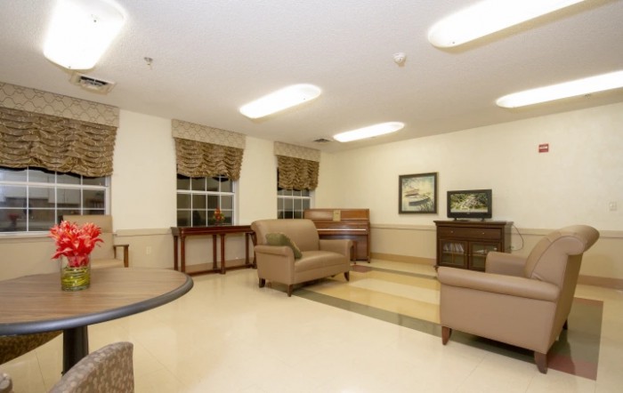 A cozy waiting room with comfortable seating and warm lighting.