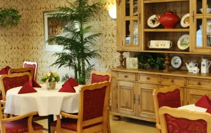 A cozy restaurant dining area with wooden furniture and elegant decor.