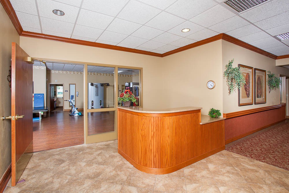 A modern reception area with wooden paneling and a welcoming atmosphere.