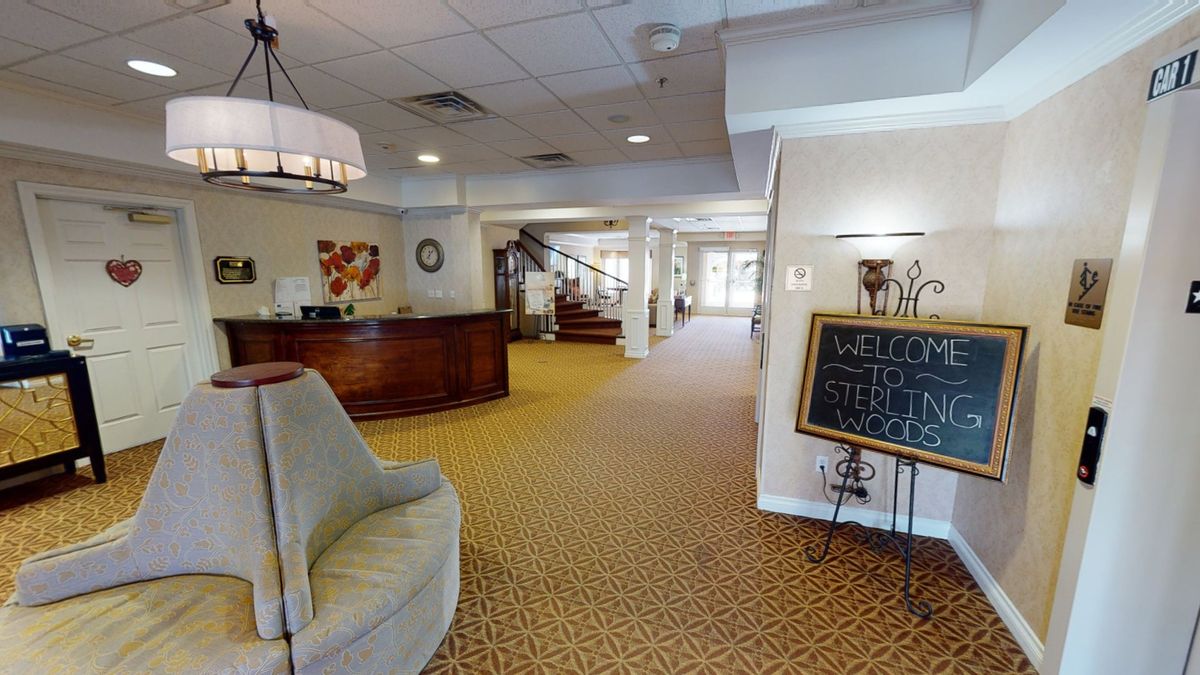 A welcoming hotel lobby featuring a reception desk, comfortable seating, and elegant lighting.