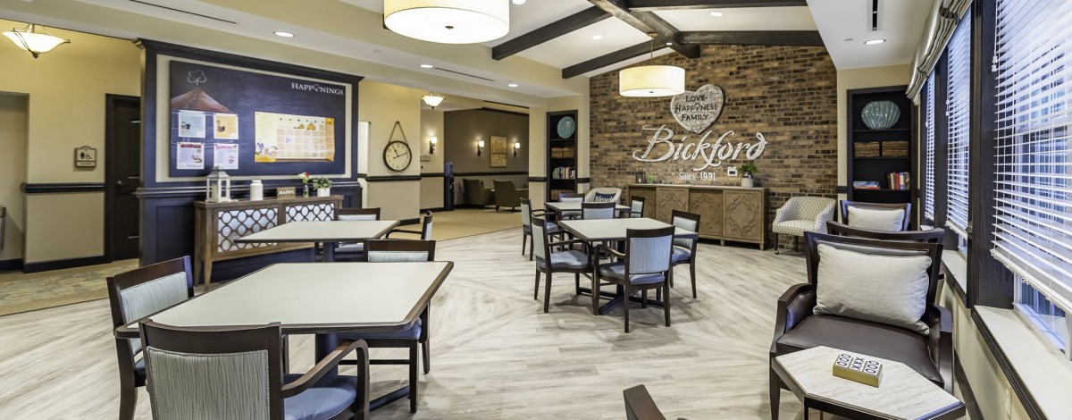 A modern dining area with elegant furnishings and stylish lighting.